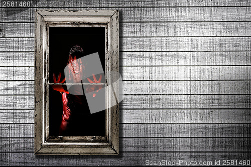 Image of Image of Bleeding Woman in Window
