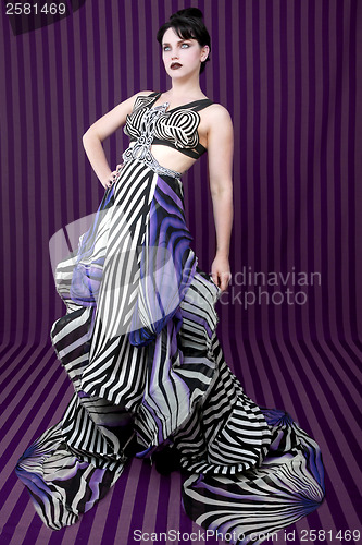 Image of Woman Wearing Striped Fashion With Dramatic Lighting 