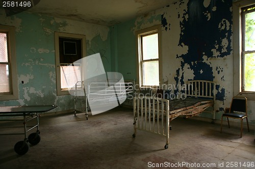 Image of Delapidated Hospital Building With Empty Rusted Beds