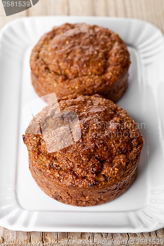 Image of two fresh buns in white plate 