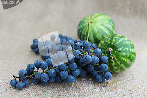 Image of still life from two watermelons and grape