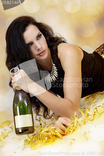 Image of Beautiful young woman partying with champagne