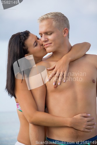 Image of smiling young couple having fun in summer holiday