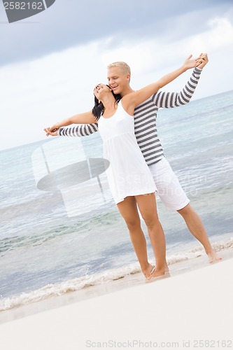 Image of smiling young couple having fun in summer holiday