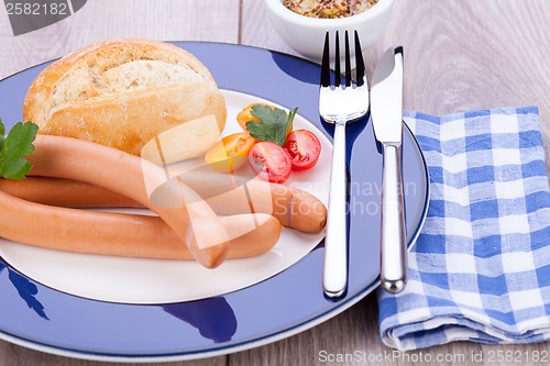 Image of tasty sausages frankfurter with grain bread 