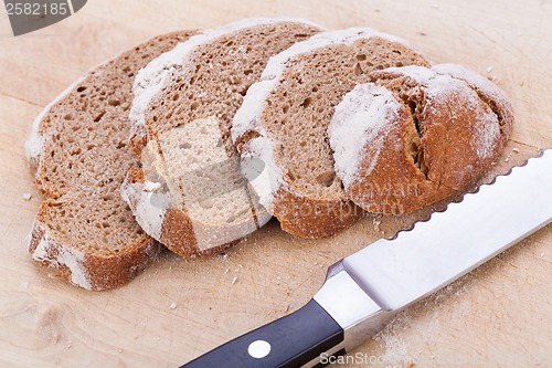 Image of homemade fresh baked bread and knife 