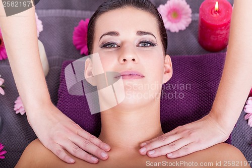 Image of Woman having a relaxing facial massage