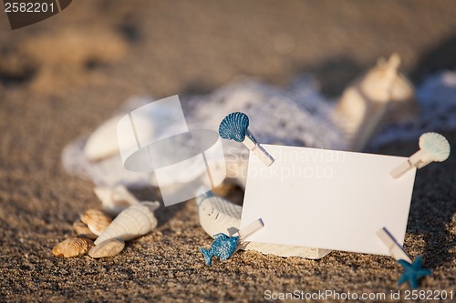 Image of sailing boat and seashell in sand decoration closeup