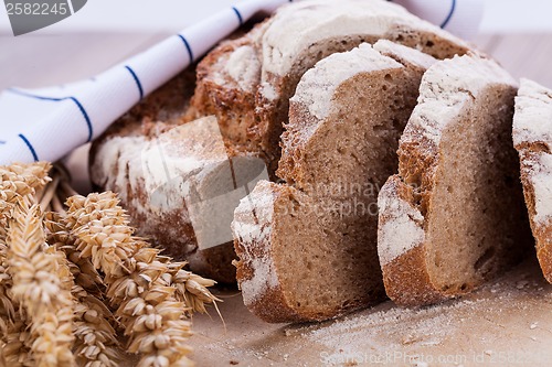 Image of homemade fresh baked bread and knife 