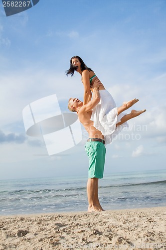 Image of smiling young couple having fun in summer holiday