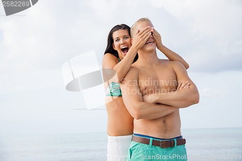 Image of smiling young couple having fun in summer holiday
