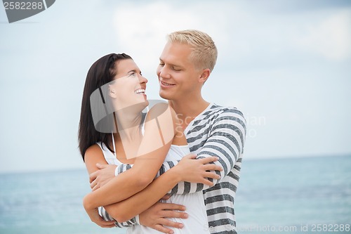 Image of smiling young couple having fun in summer holiday