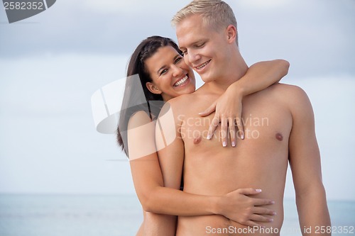 Image of smiling young couple having fun in summer holiday