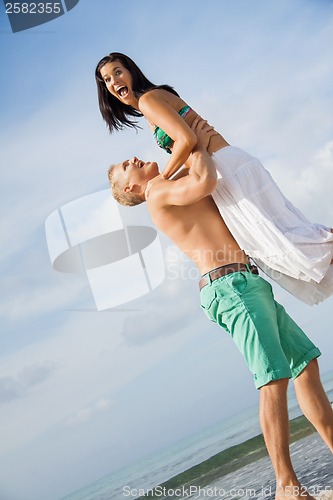 Image of smiling young couple having fun in summer holiday