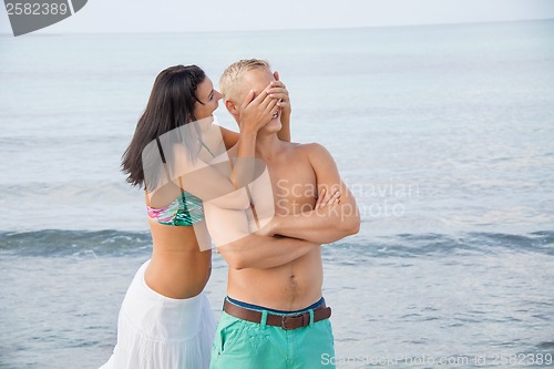 Image of smiling young couple having fun in summer holiday