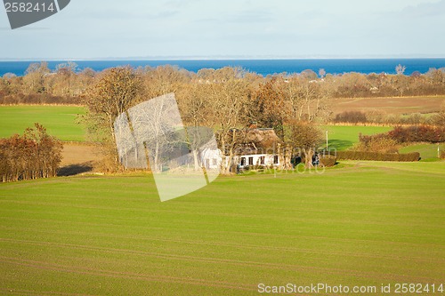 Image of beautiful landscape in autum baltic see green field blue sky