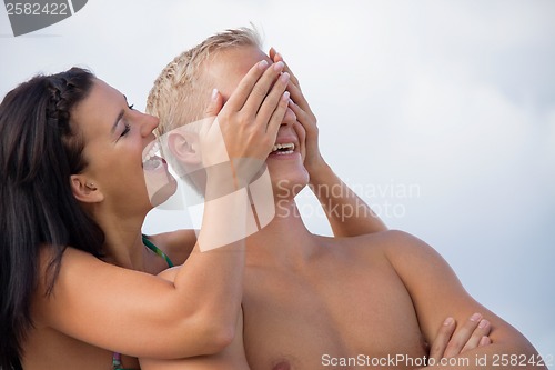 Image of smiling young couple having fun in summer holiday