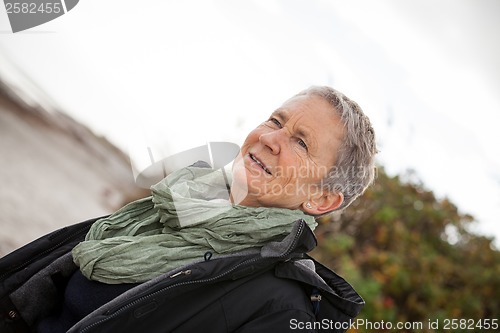 Image of happy grey-haired elderly woman senior outdoor