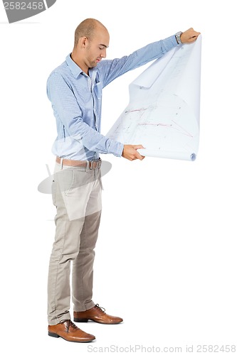 Image of Architect reading a blueprint