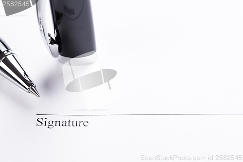 Image of macro closeup sign document contract pen filler 