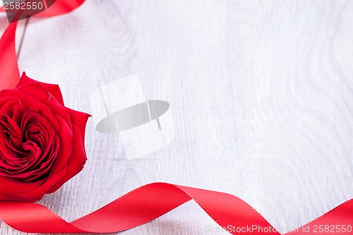 Image of Bouquet of red roses with ribbon border