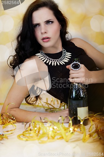 Image of Beautiful young woman partying with champagne