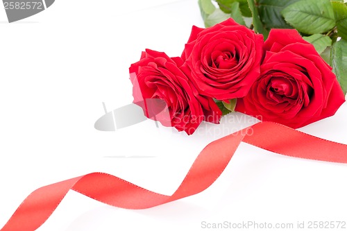 Image of Bouquet of red roses with ribbon border