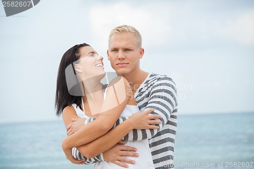 Image of smiling young couple having fun in summer holiday