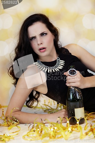 Image of Beautiful young woman partying with champagne