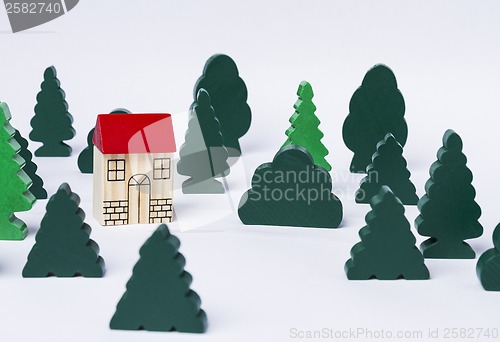 Image of toy house in forest