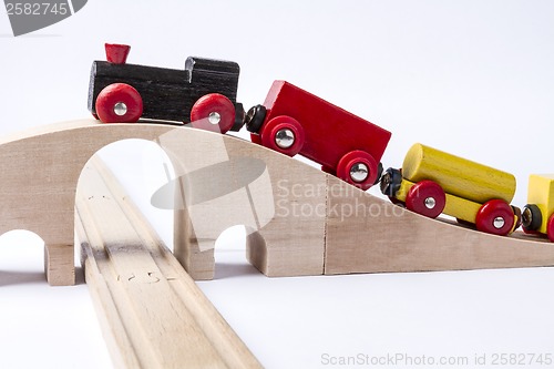 Image of wooden toy train on bridge