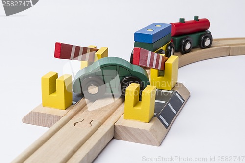 Image of toy car on railroad crossing