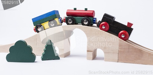 Image of wooden toy train on bridge