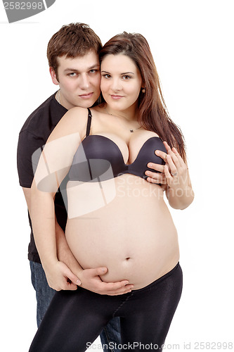 Image of loving happy couple, pregnant woman with her husband, isolated o