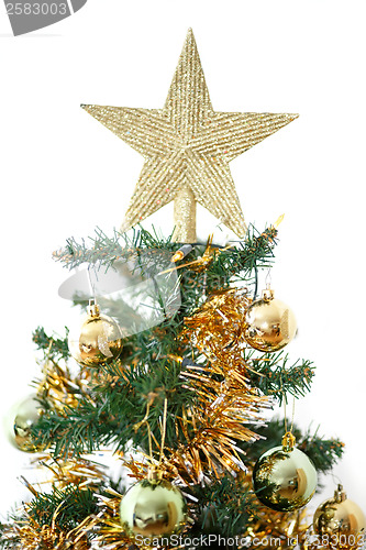 Image of Decorated christmas tree with yellow and green balls 