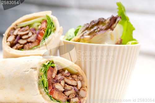 Image of kafta shawarma chicken pita wrap roll sandwich