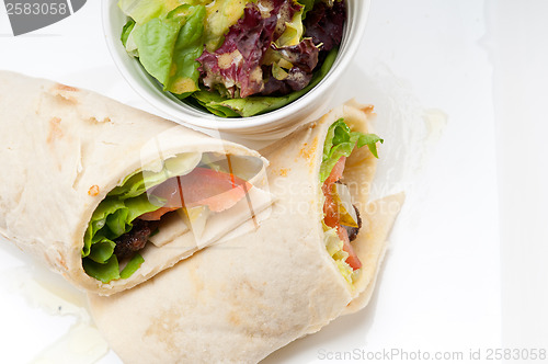 Image of kafta shawarma chicken pita wrap roll sandwich