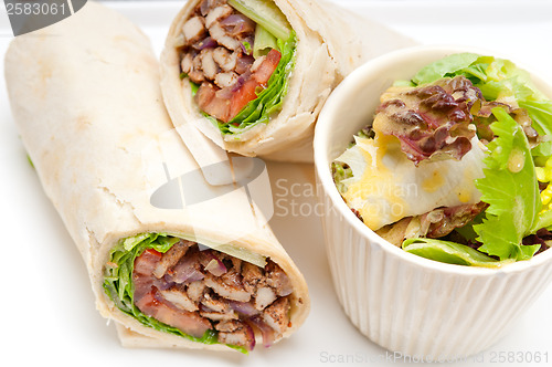 Image of kafta shawarma chicken pita wrap roll sandwich