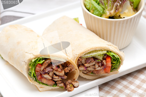 Image of kafta shawarma chicken pita wrap roll sandwich