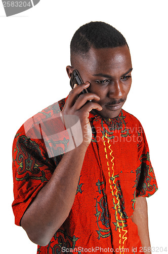 Image of Black man on cell phone.