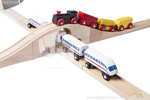 Image of wooden toy trains on railway