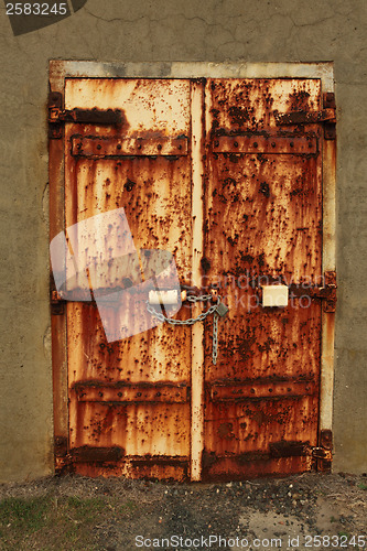 Image of Rusty padlocked door