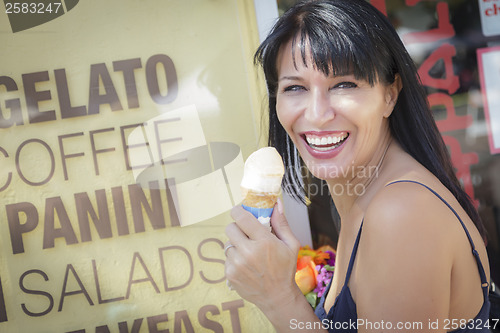 Image of Pretty Italian Woman Enjoying Her Gelato at the Street Market.