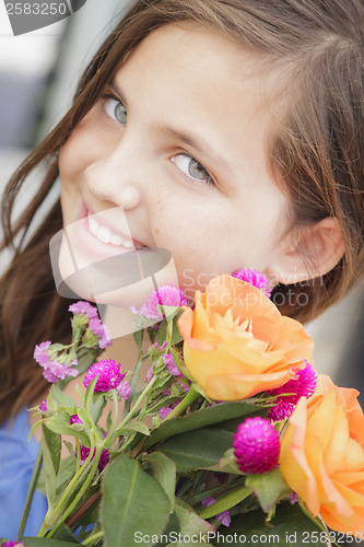 Image of Pretty Young Girl Holding Flower Bouquet at the Market