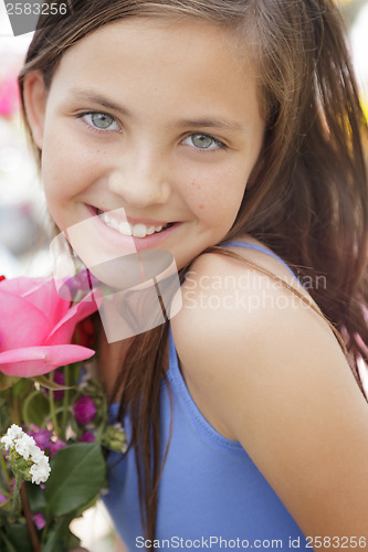 Image of Pretty Young Girl Holding Flower Bouquet at the Market