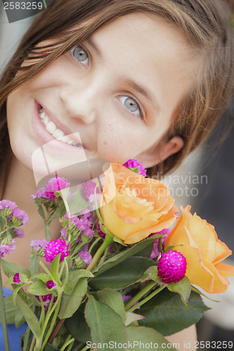 Image of Pretty Young Girl Holding Flower Bouquet at the Market