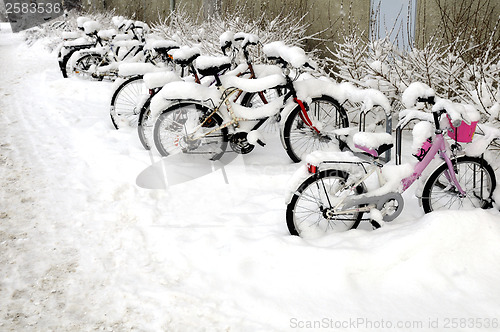 Image of Bicycles covered with snow 