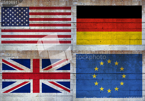 Image of Flags over concrete wall