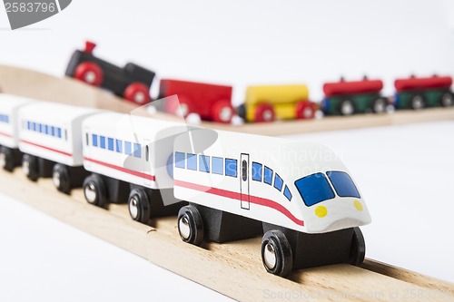 Image of wooden toy trains on railway