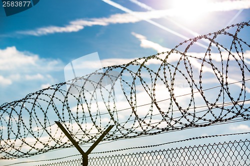 Image of fence with barbed wire